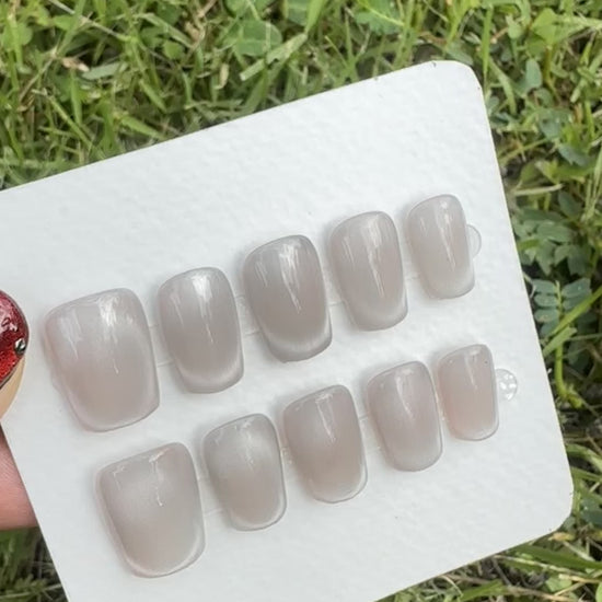 gray press on nail video under the light 
